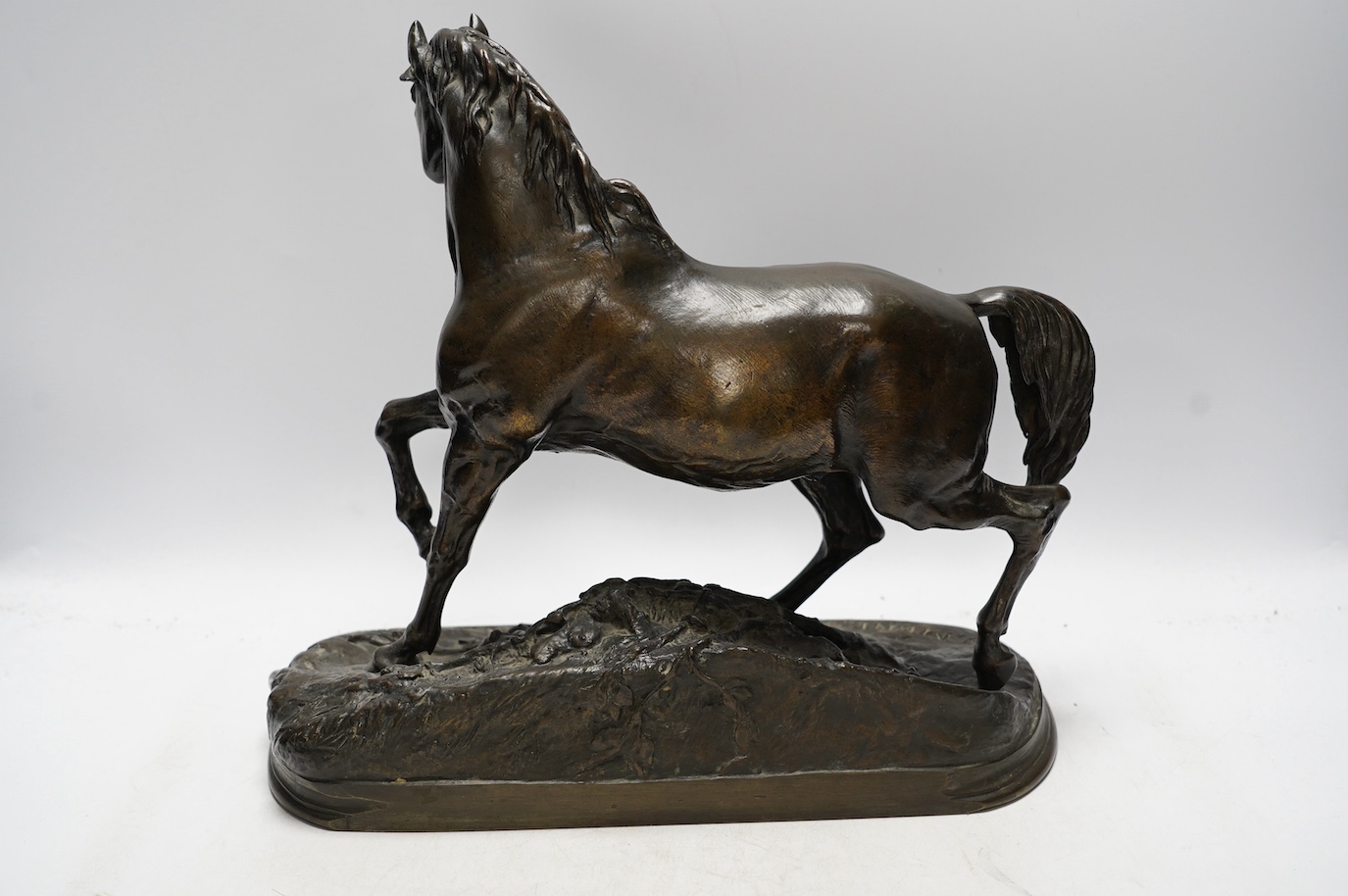 After Pierre Jules Mene (1810-1879), a bronze study of a galloping horse, signed, 35cm wide. Condition - good